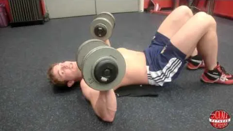 Dumbbell Laying Reverse Crunch into a Floor Press
