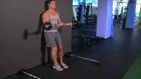 Standing Barbell Curl Drop Set Leaning Against Wall