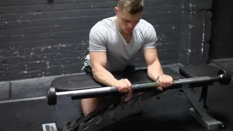 Palms Down Barbell Wrist Curl Over Bench