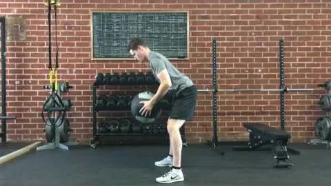 Toe Touch Squat-to-Stand With Medicine Ball Overhead Reach